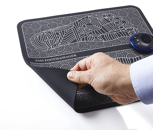 Hand holding a flexible EMS foot massager designed for foot pain relief and neuropathy treatment. Best EMS foot massager for portability and convenience.