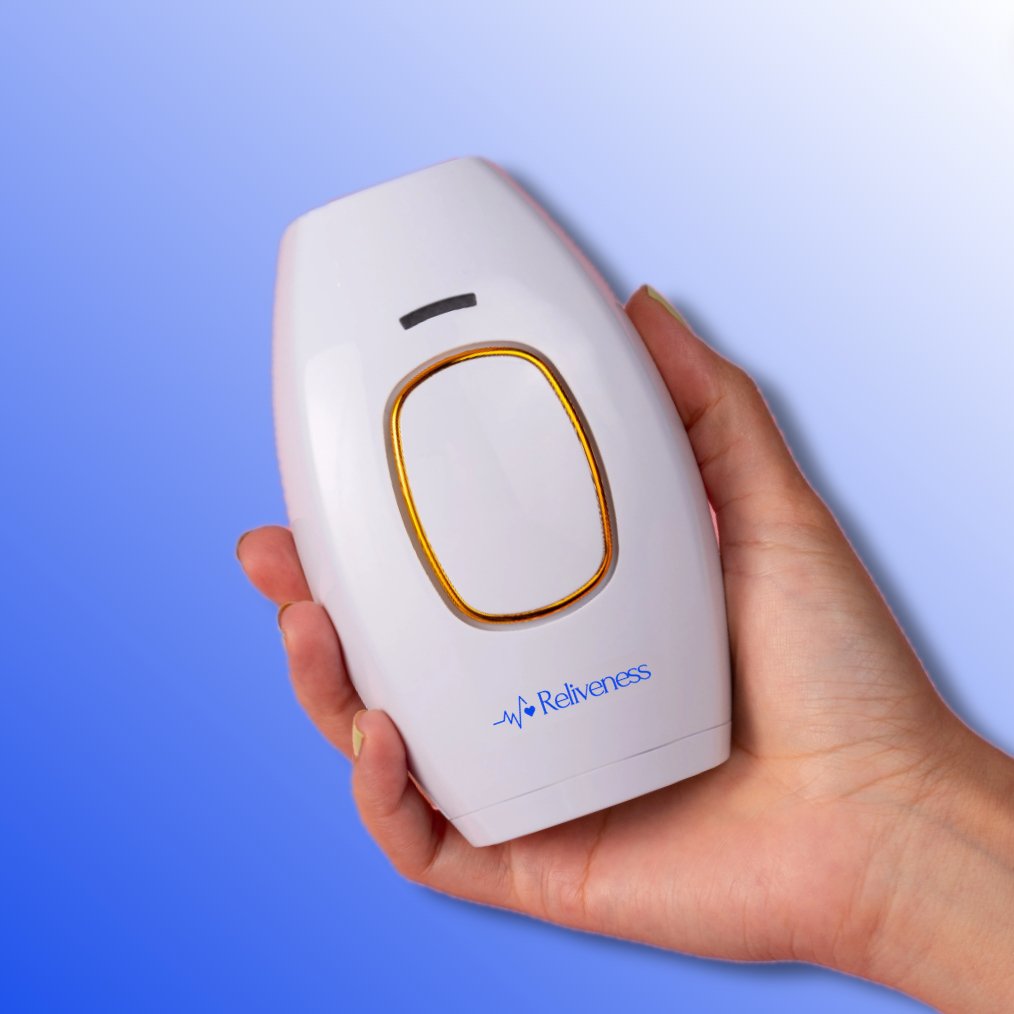 Hand holding the Reliveness™ at-home laser hair removal device, designed for permanent hair reduction. The compact and sleek design makes it easy to use for full-body treatments, offering a cost-effective alternative to salon laser hair removal. Ideal for achieving smooth, hair-free skin.