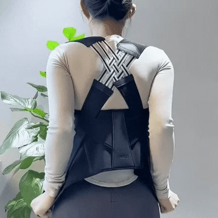 Woman wearing a posture corrector with cross-back design for improved posture support. Best posture corrector for women to relieve back pain and improve alignment.