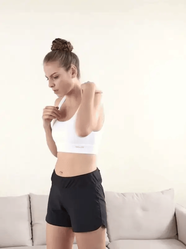 Woman demonstrating how to wear a shoulder brace for effective shoulder support and pain relief. Shoulder compression sleeve provides ergonomic support, improves posture, and aids in injury recovery.