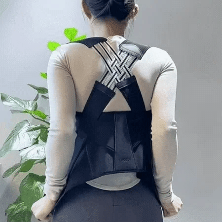 Woman wearing a posture corrector with cross-back design for improved posture support. Best posture corrector for women to relieve back pain and improve alignment.
